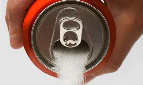 An aluminium can full of sugar being poured out